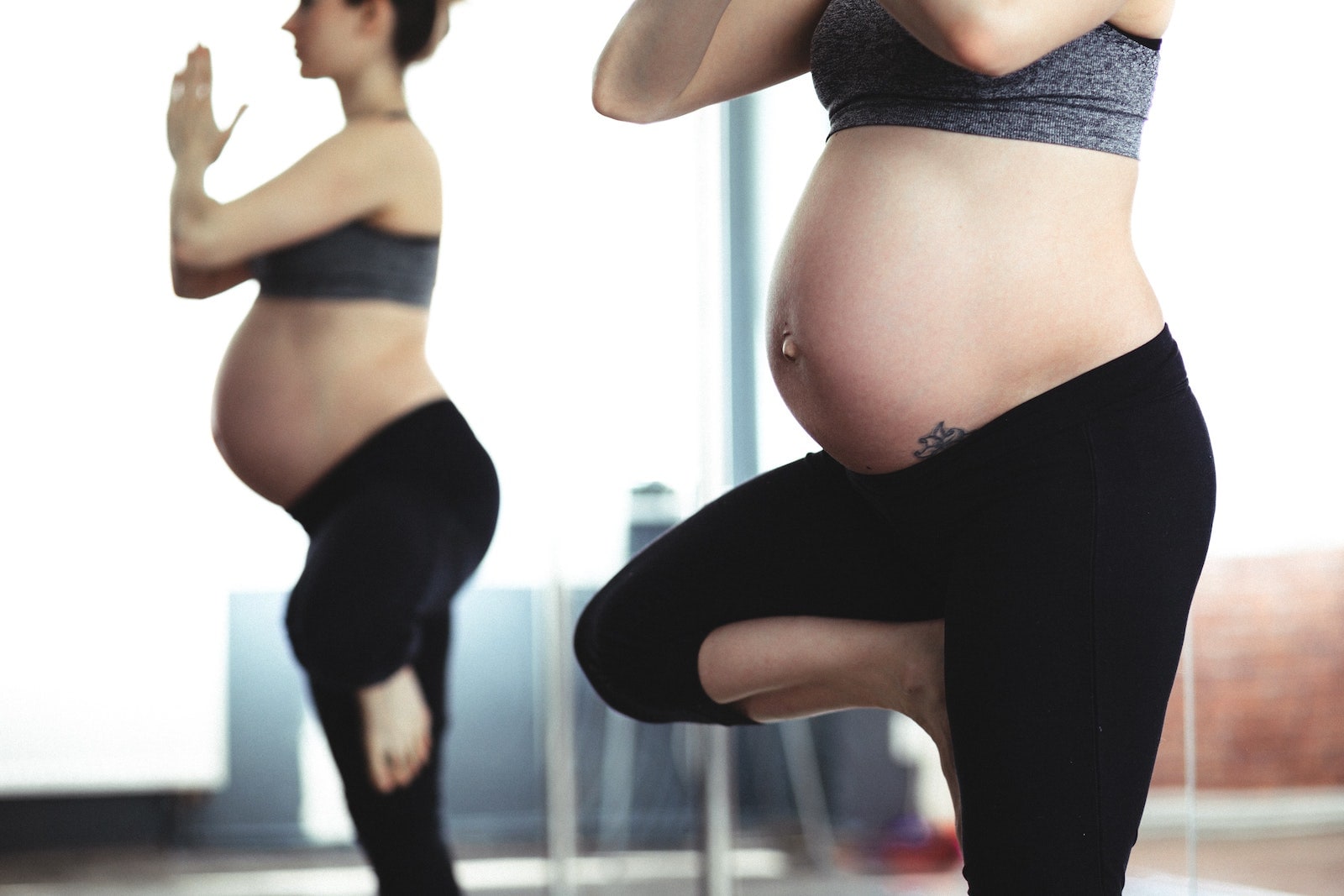 Pregnant woman doing a yoga pose
