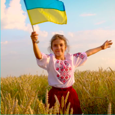Child holding Ukranian flag